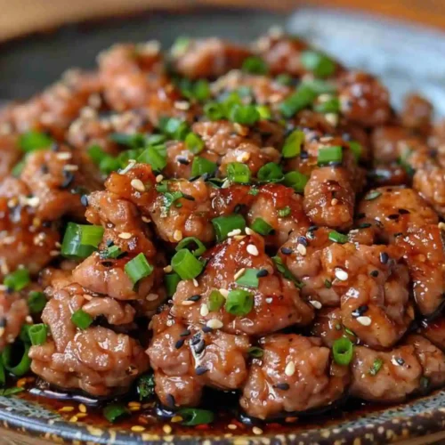 Asian Ground Chicken Recipes – Easy, Healthy Dinner Ideas 4 Asian Ground Chicken Recipes featuring tender ground chicken coated in a sticky sesame soy sauce, topped with green onions and sesame seeds.