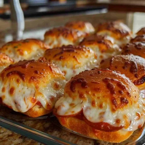Hawaiian Roll Pizza Sliders 5 Golden baked Hawaiian roll pizza sliders topped with melted mozzarella and pepperoni, served fresh from the oven.